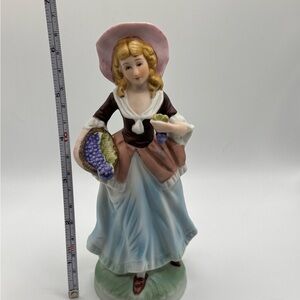 Ceramic girl holding basket